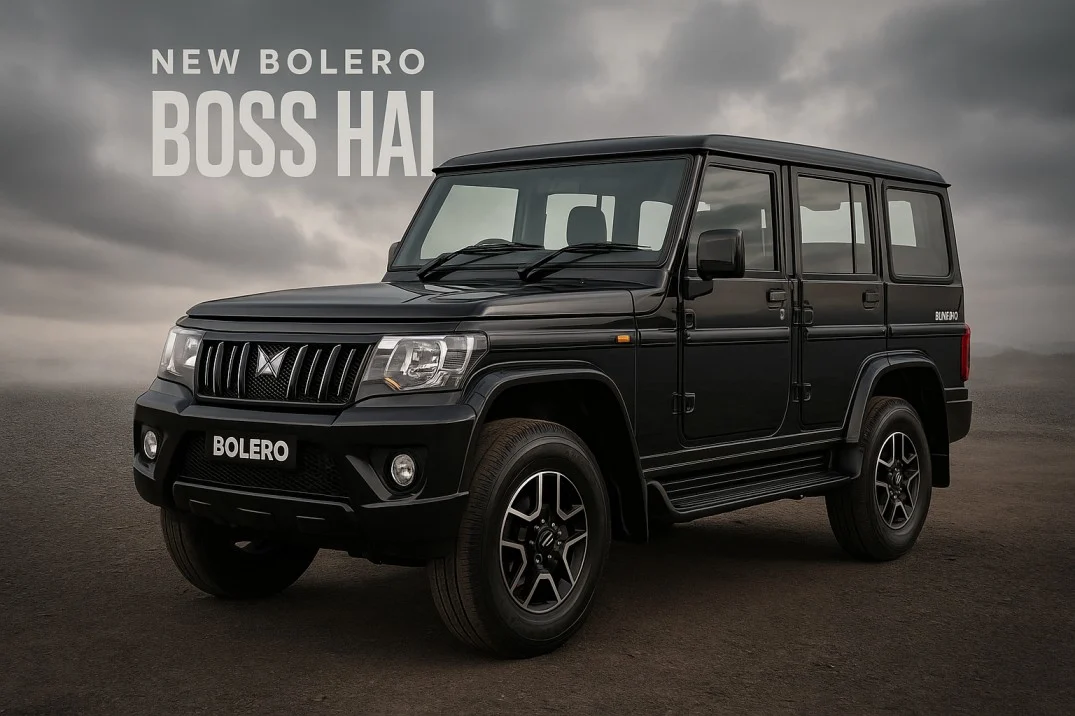 New 2025 Mahindra Bolero in black showcased on rugged terrain with bold “Boss Hai” branding in the background.